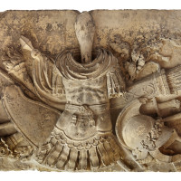 Reliéf s válečnými trofejemi, 1833-34, pískovec (v expozici osazeno v r. 2017)